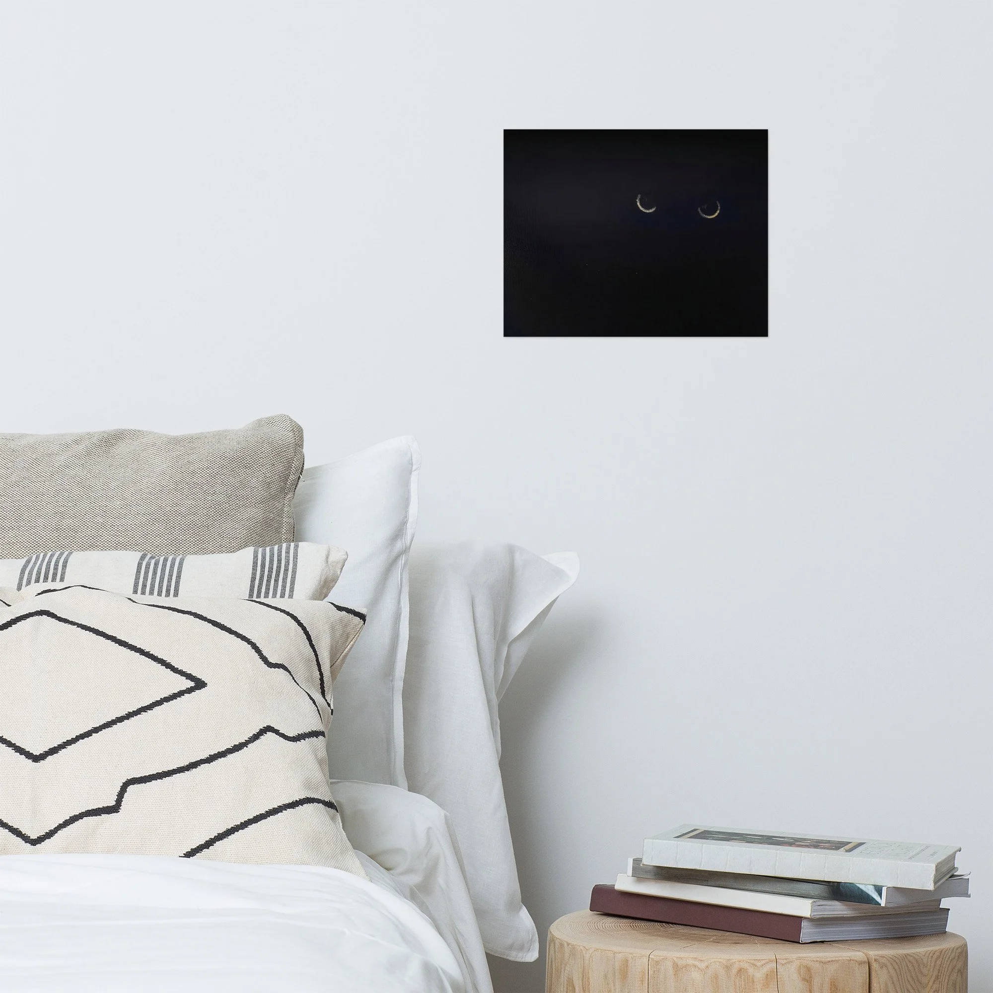 Moody bedroom decor featuring a black cat surrealist art print on a white bedroom wall