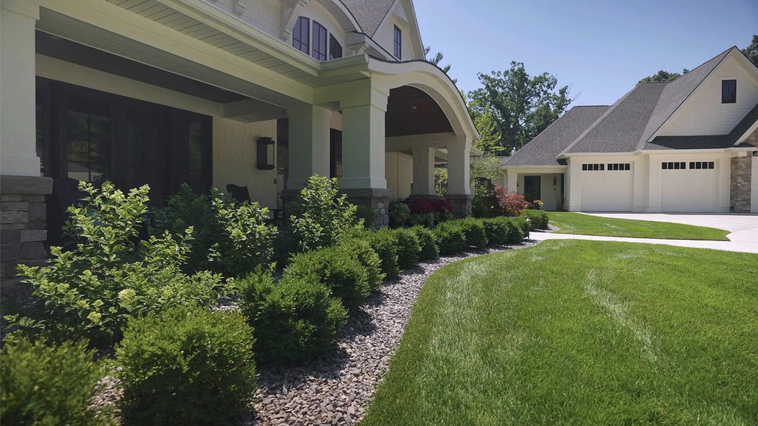 Gated Driveway Surrounded by Elegant Plantings in Hudsonville, MI
