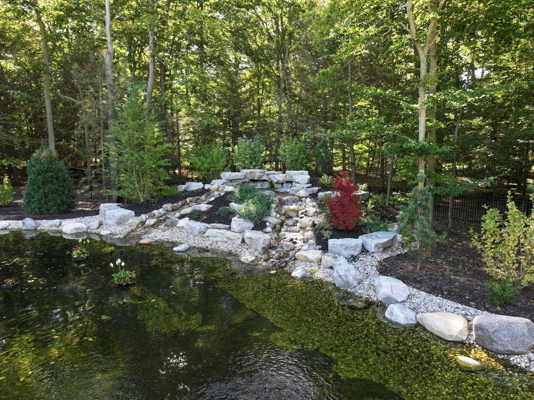 pond with cascading waterfall in Holland, MI