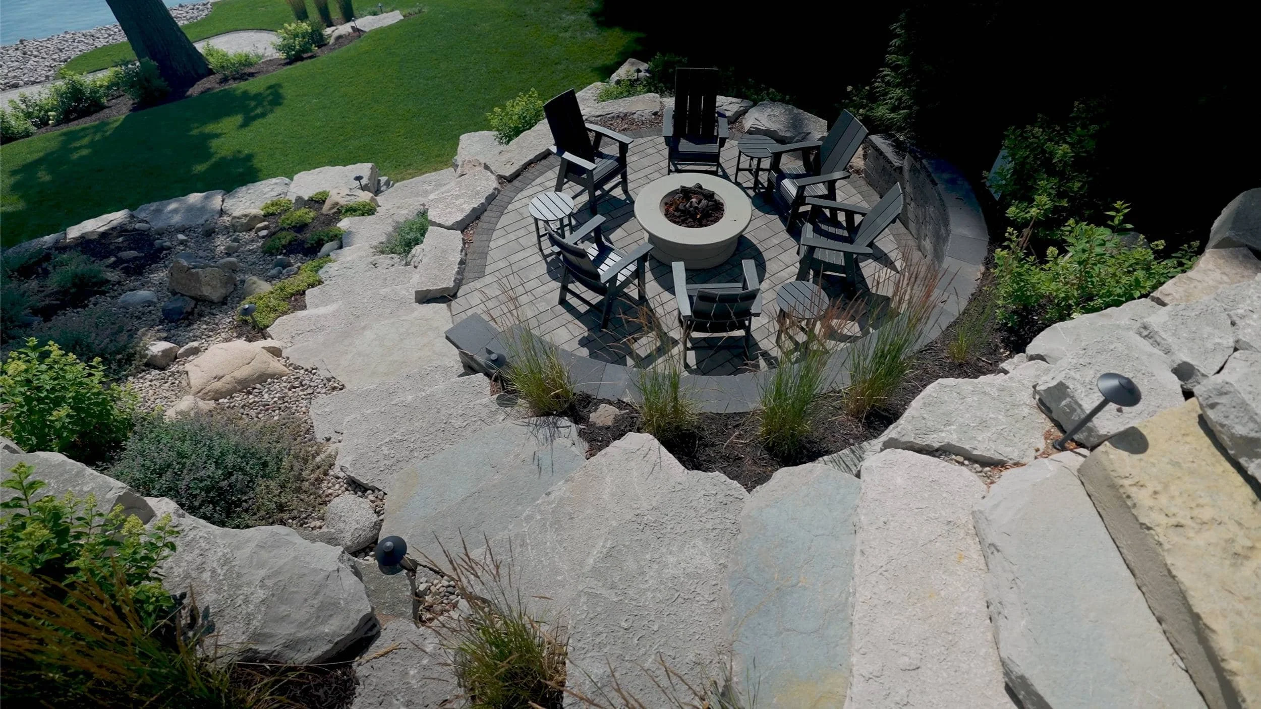 Terraced Retaining Walls Supporting Lakeside Plantings in Ada, MI