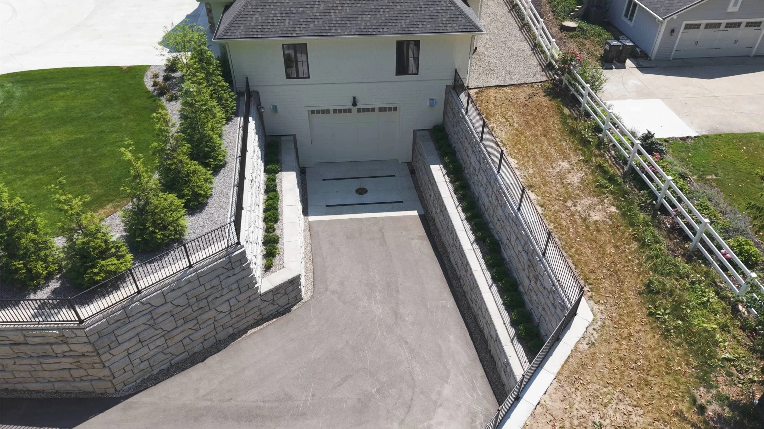 Fire Pit Seating Area Overlooking Infinity-Edge Pool in Jamestown, MI
