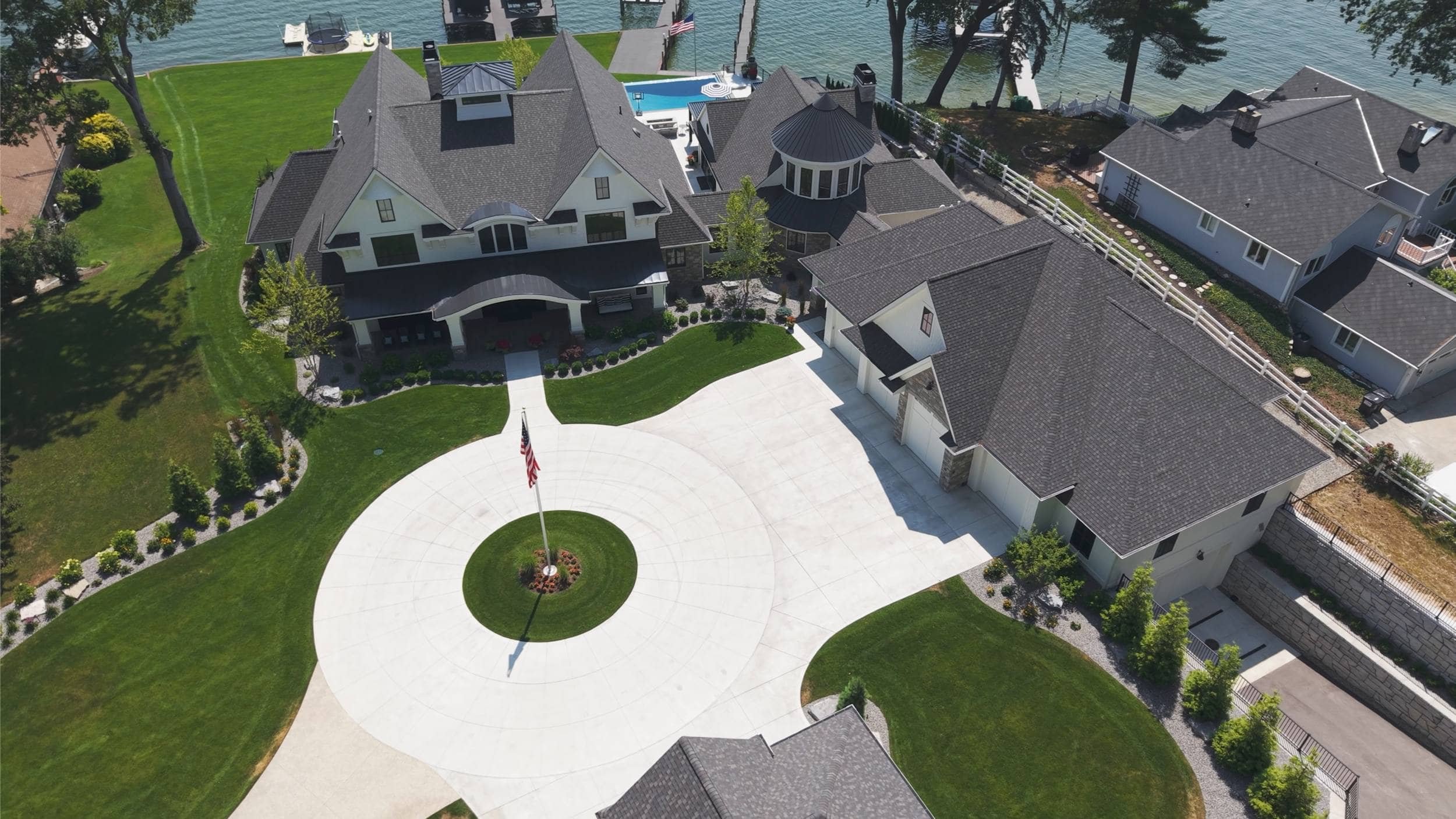 Gated Driveway Framing Symmetrical Landscape Design in Cascade, MI