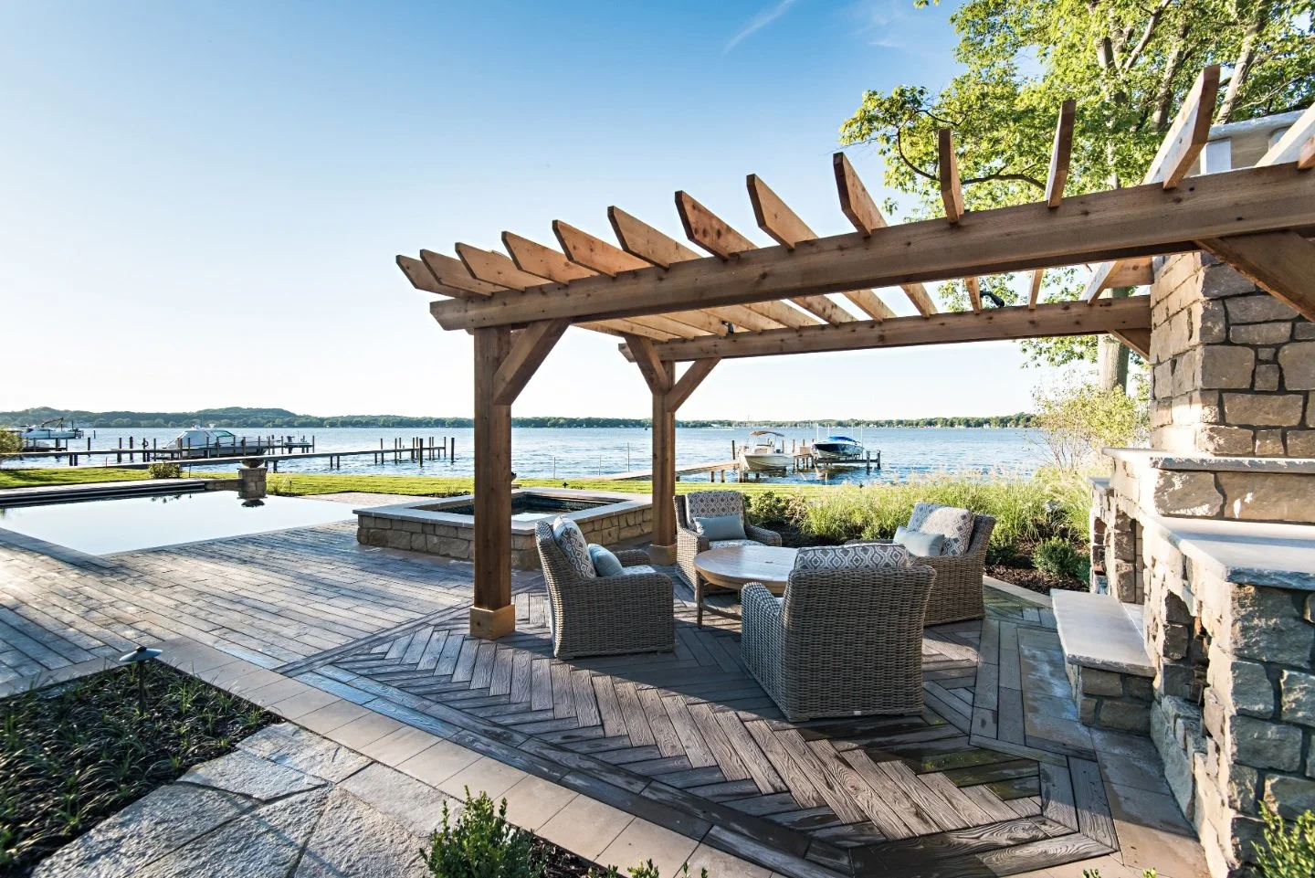 Pergola and patio in waterfront property in East Grand Rapids, MI
