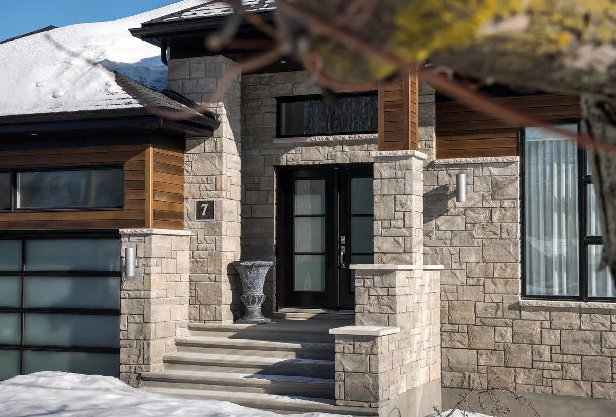 Techo-Bloc pool coping and outdoor feature materials installed around a modern pool edge