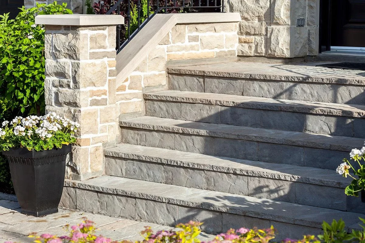 Techo-Bloc stone steps and entry feature used for a residential front walkway and porch