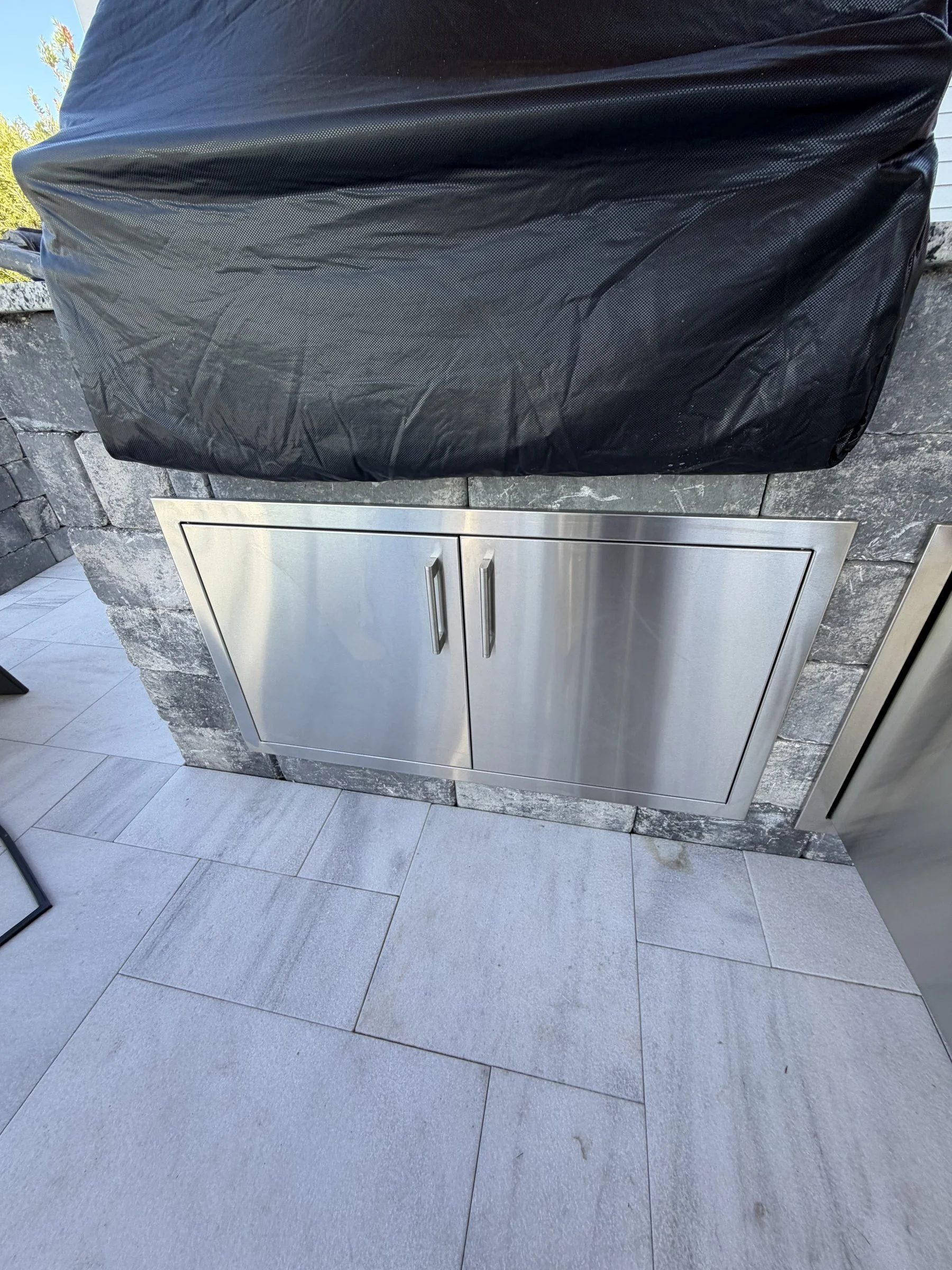 Outdoor kitchen with stainless doors on a lanai extension, Nocatee