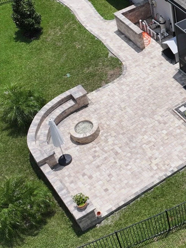 Gas fire pit with seating wall and paver patio in SilverLeaf, St. Augustine FL