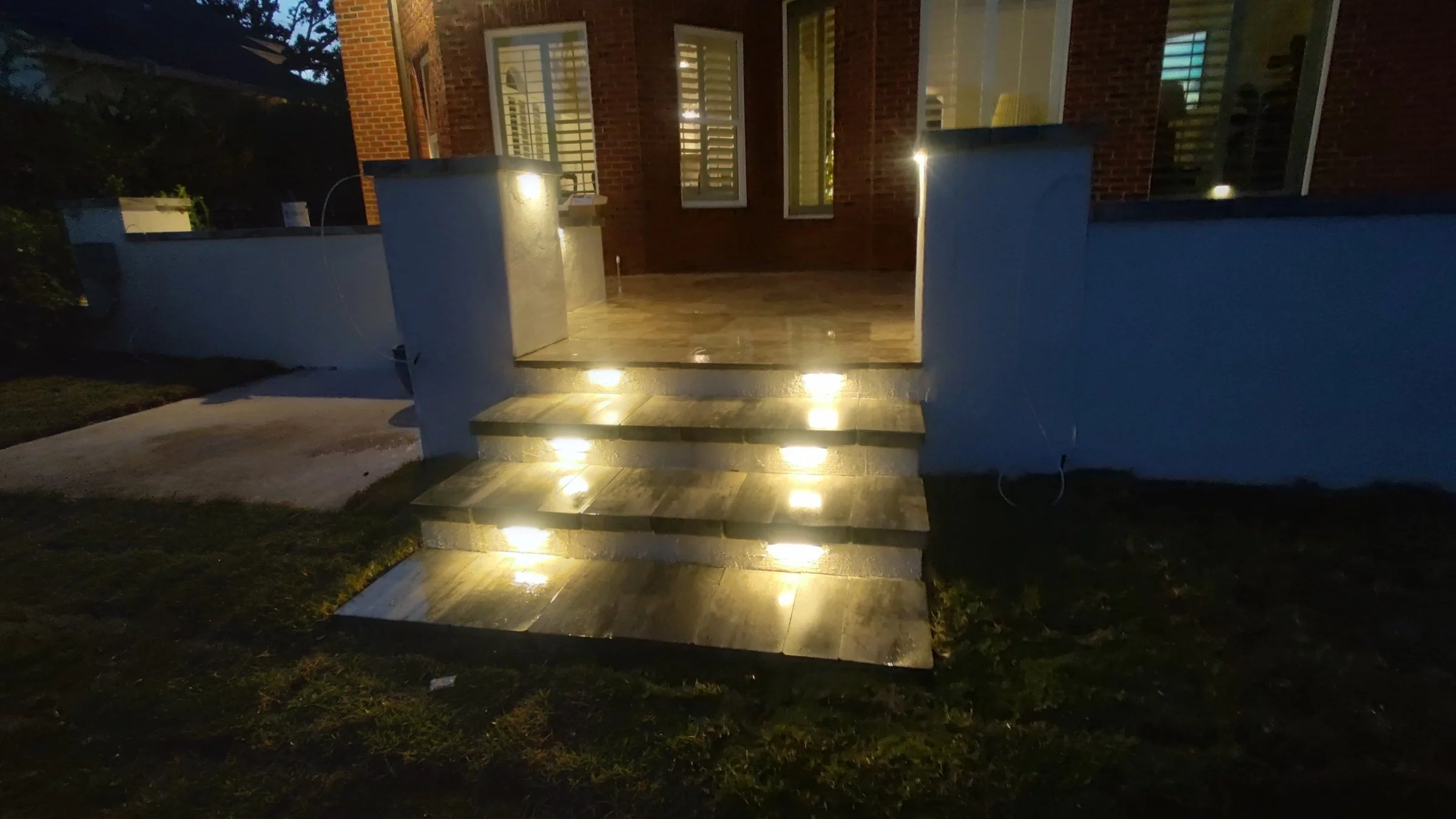 Lighted travertine steps at dusk, Ponte Vedra Beach