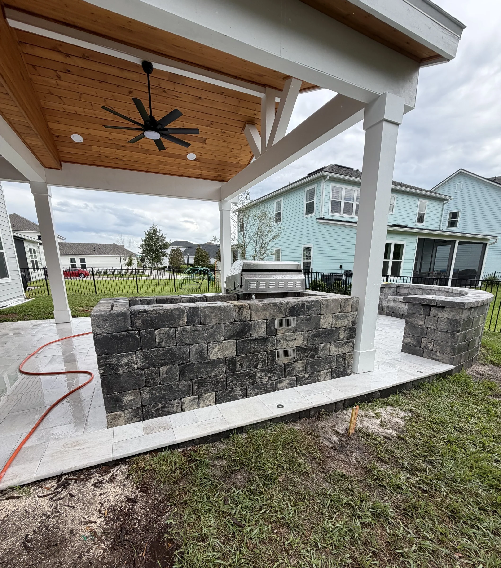 Cedar roof extension tied into the house over an outdoor kitchen, Seabrook, Nocatee FL