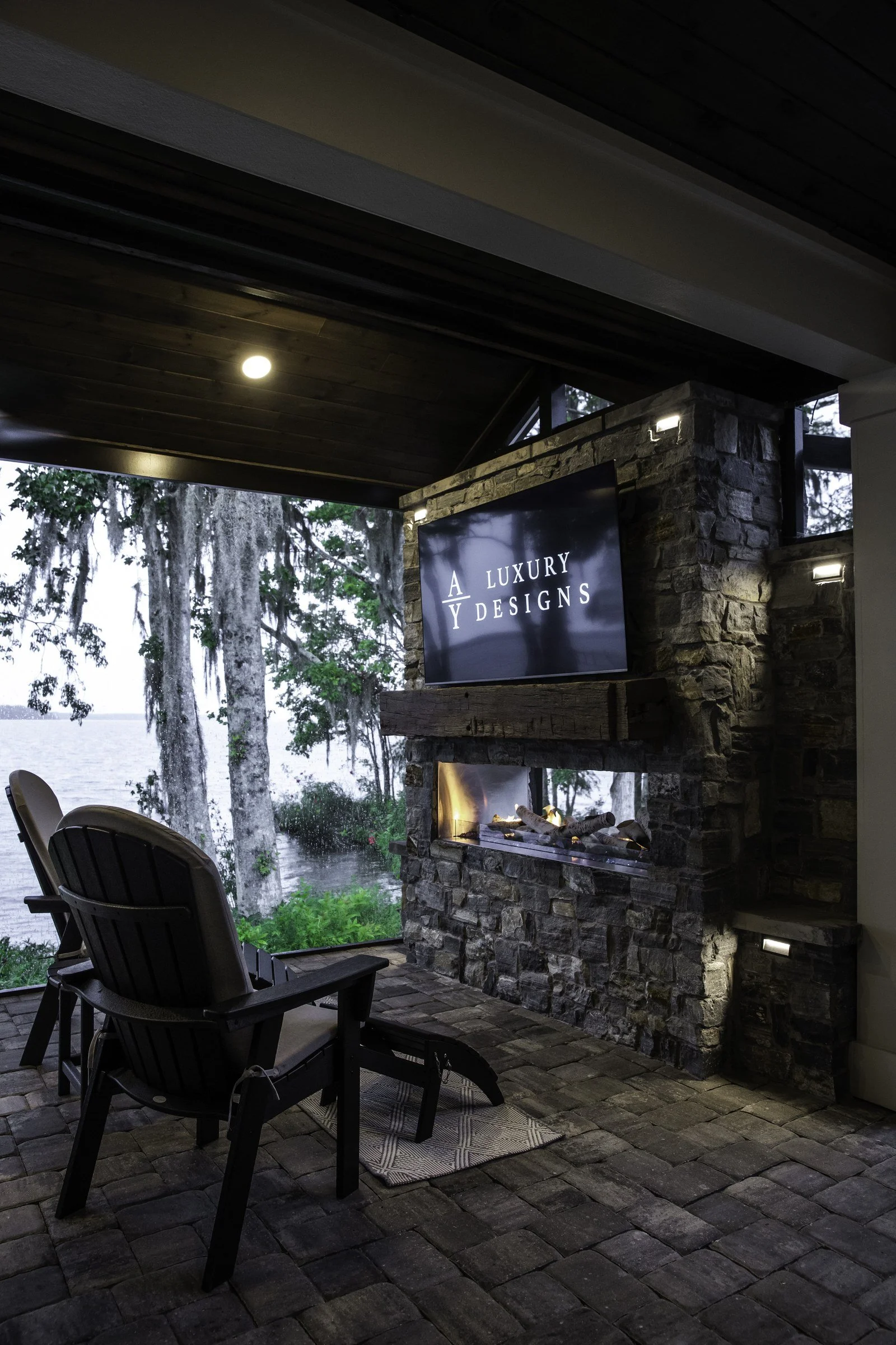 Linear outdoor fireplace with stone veneer inside a screen room, St. Augustine FL