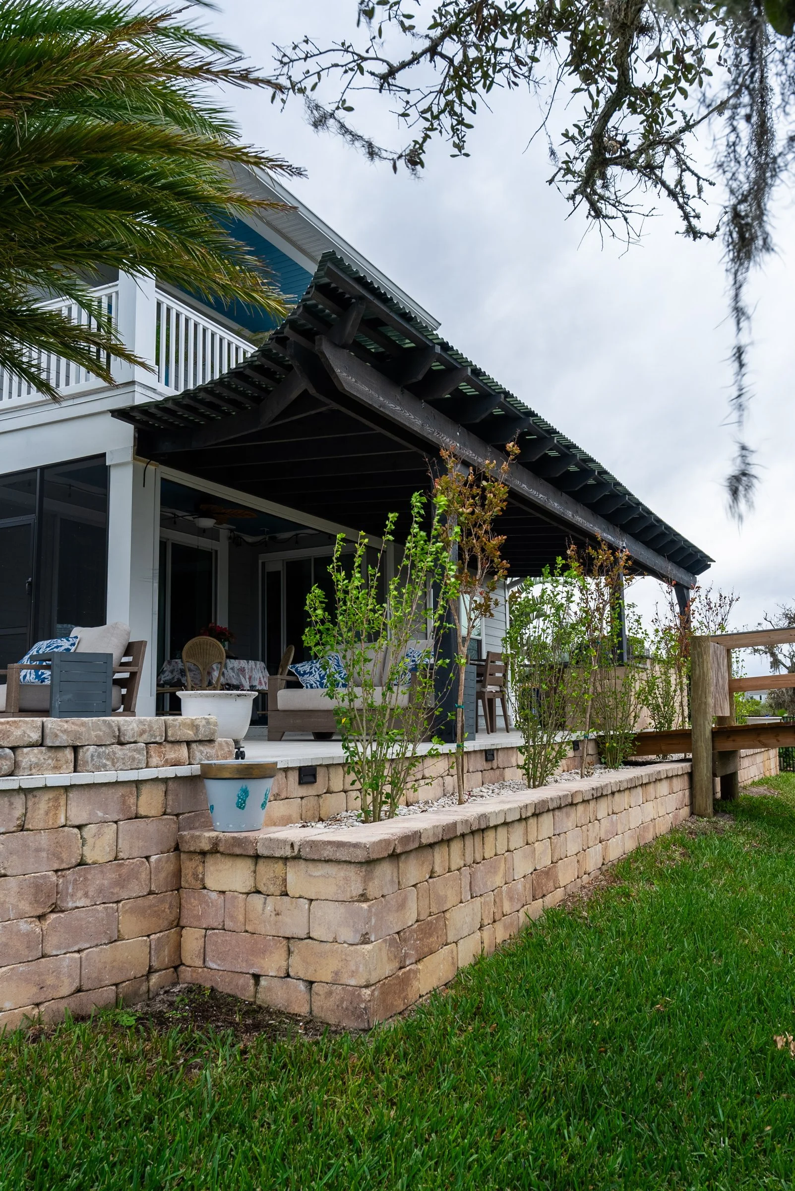 Attached pergola and seating wall seen from the yard, St. Augustine