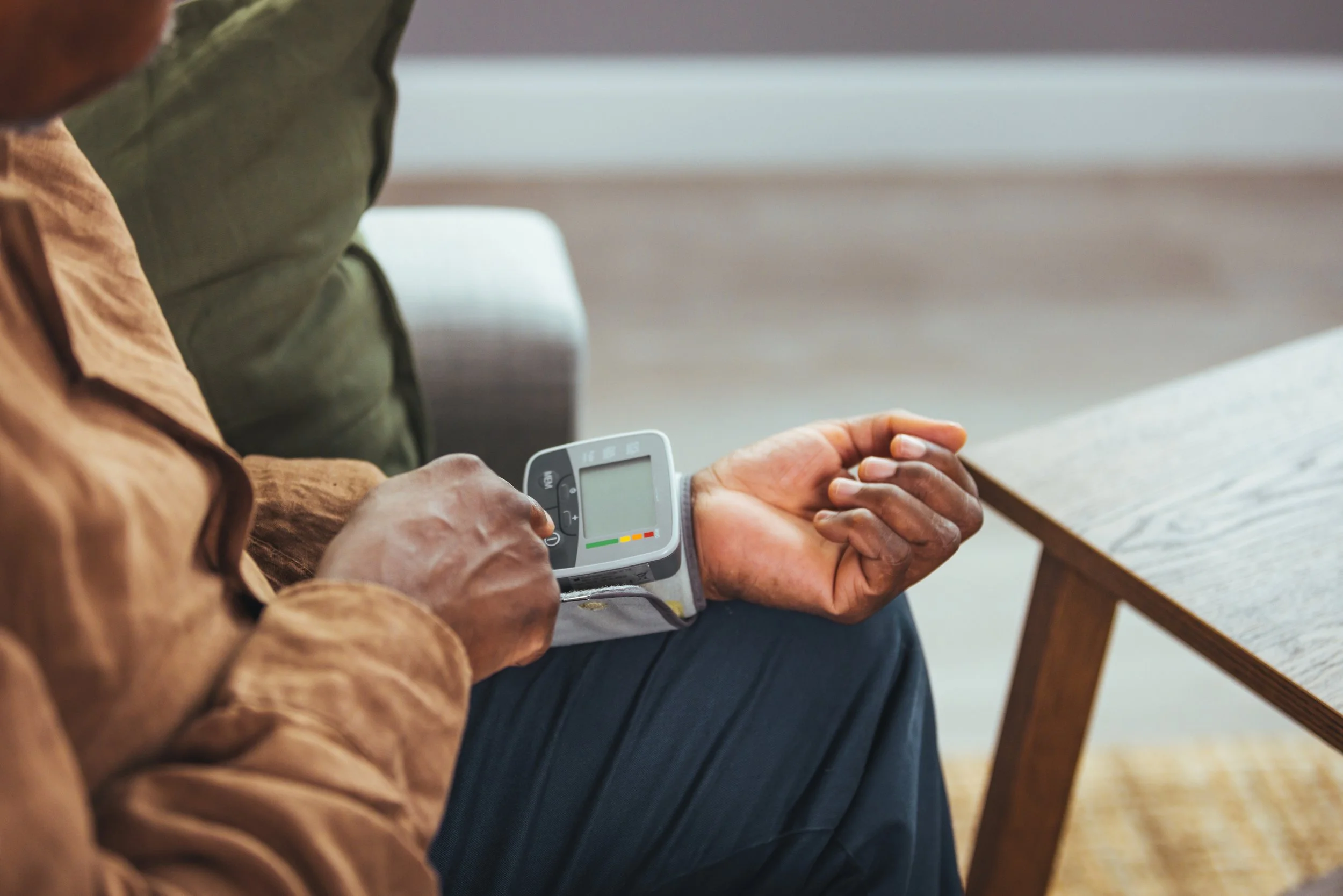 person using a blood pressure cuff