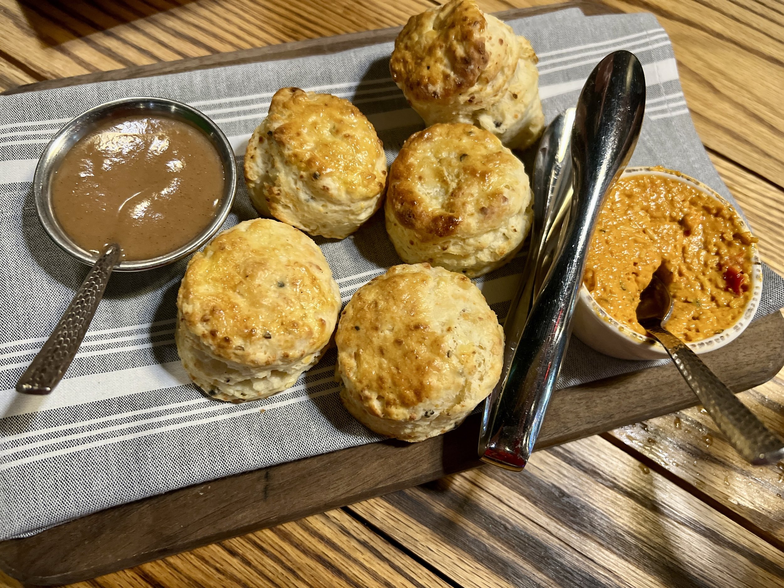 Deacon's New South smoked cheddar cheese biscuits with apple butter and pimento cheese CREDIT Jennifer Bain.jpg