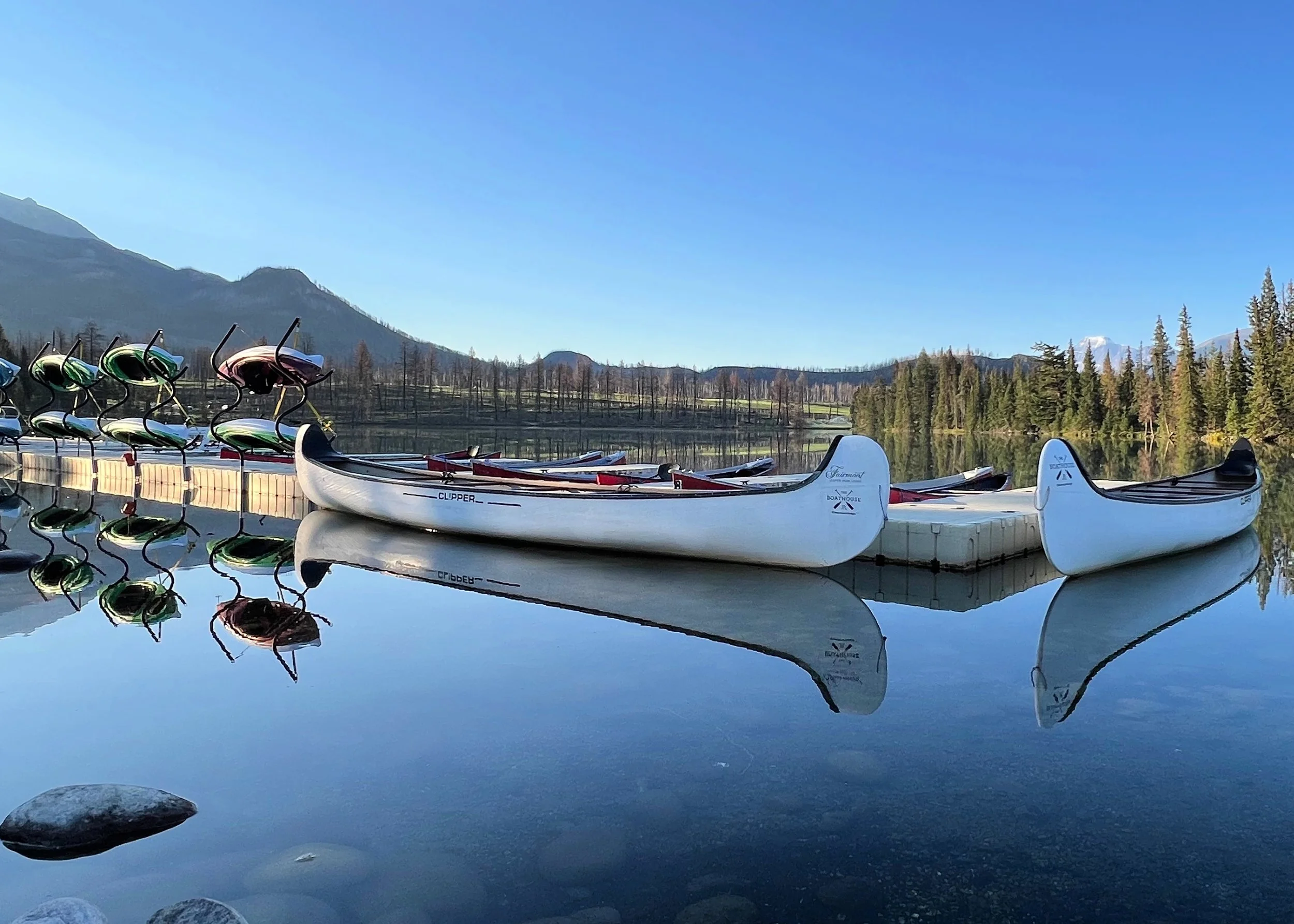 Kayaks and canoes at the ready on Lac Beauvert in Jasper National Park.jpg