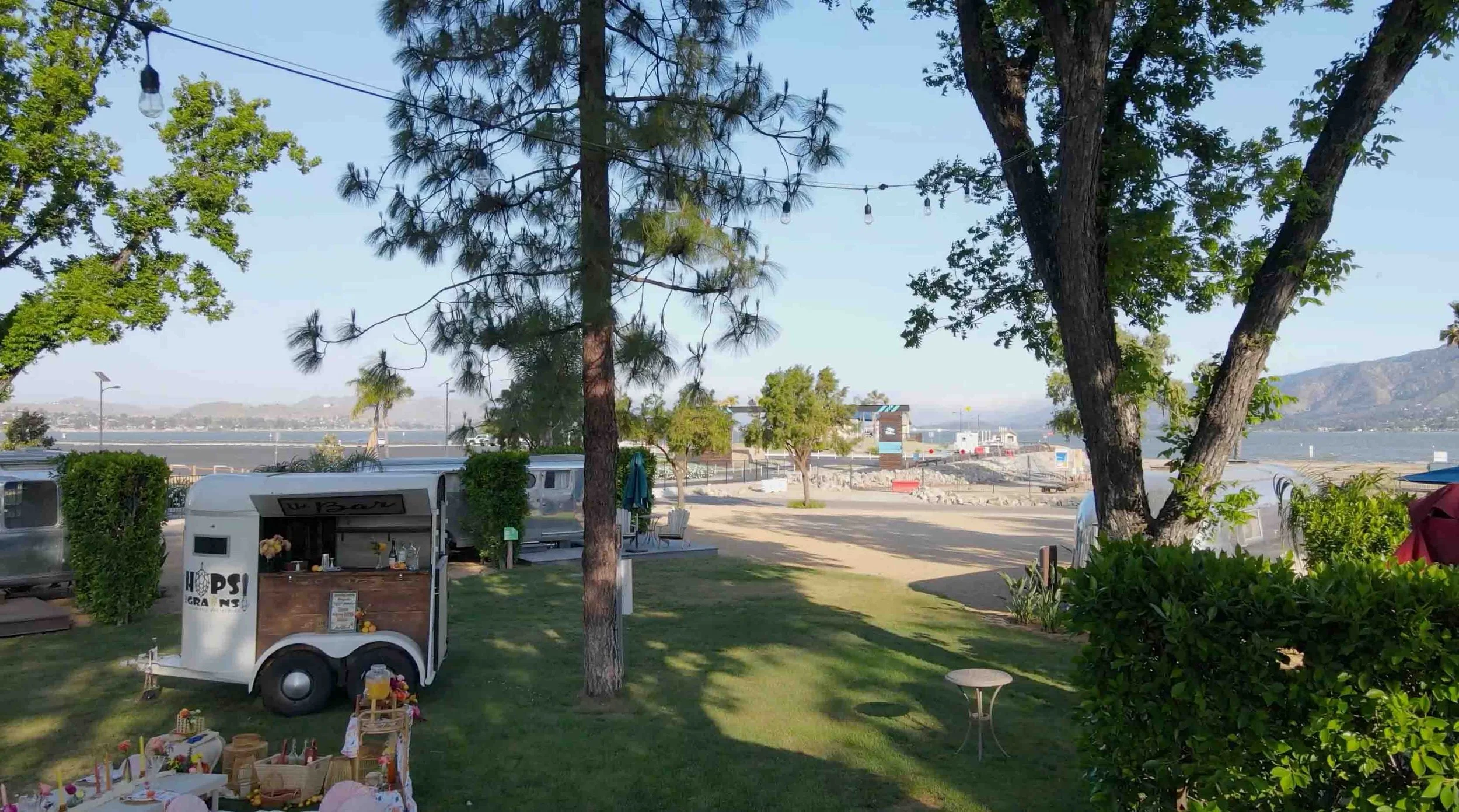 A bird’s eye view of the forty-five thousand square foot lawn and beaches at the Launch Pointe wedding and events venue in Lake Elsinore, California.