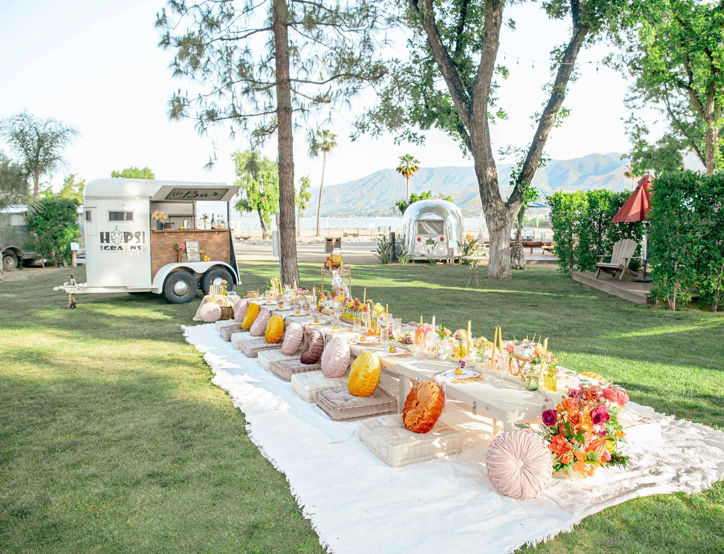 A gorgeous picnic set up and decorated for an event at Launch Pointe in Lake Elsinore, California.
