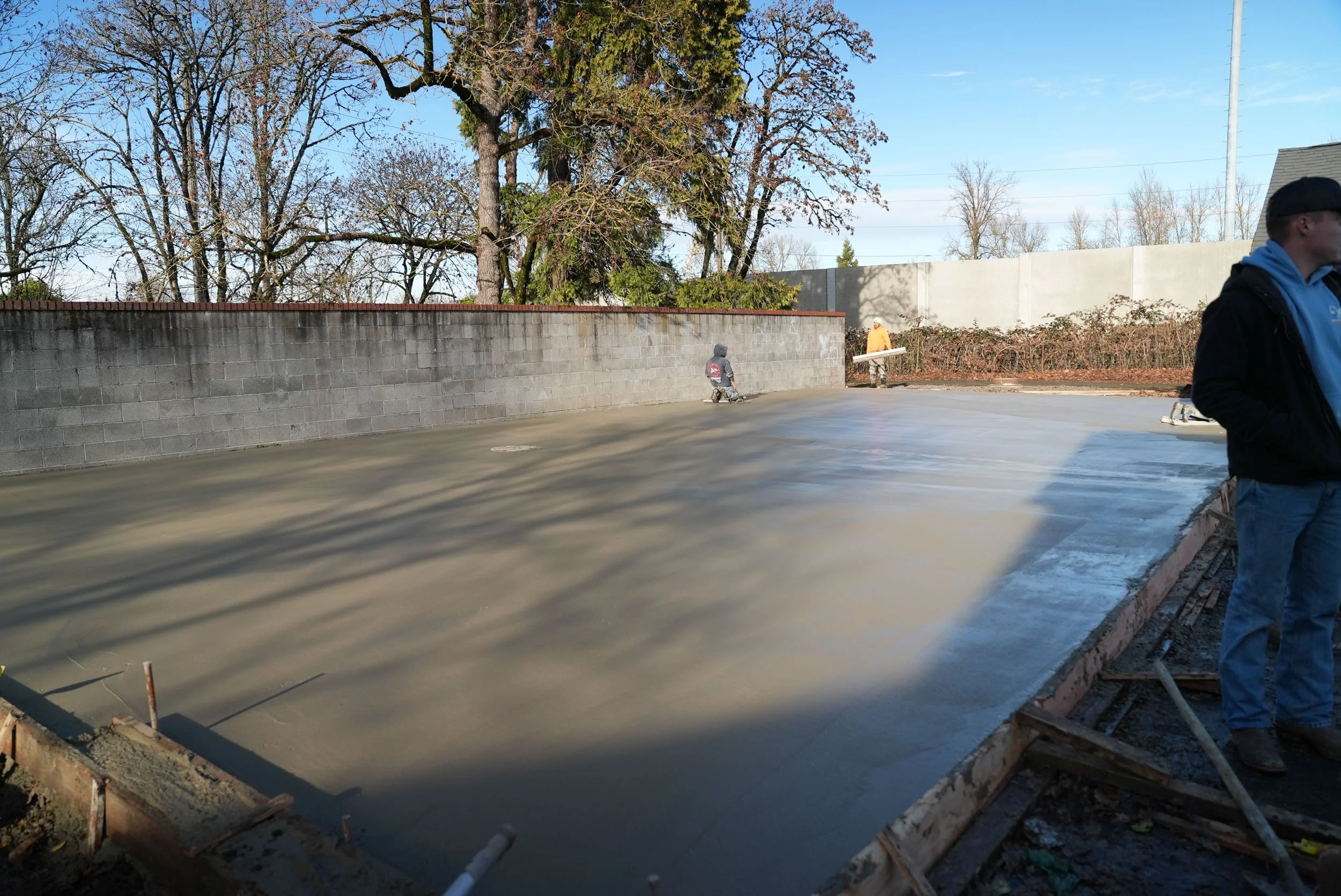 A newly poured concrete driveway.