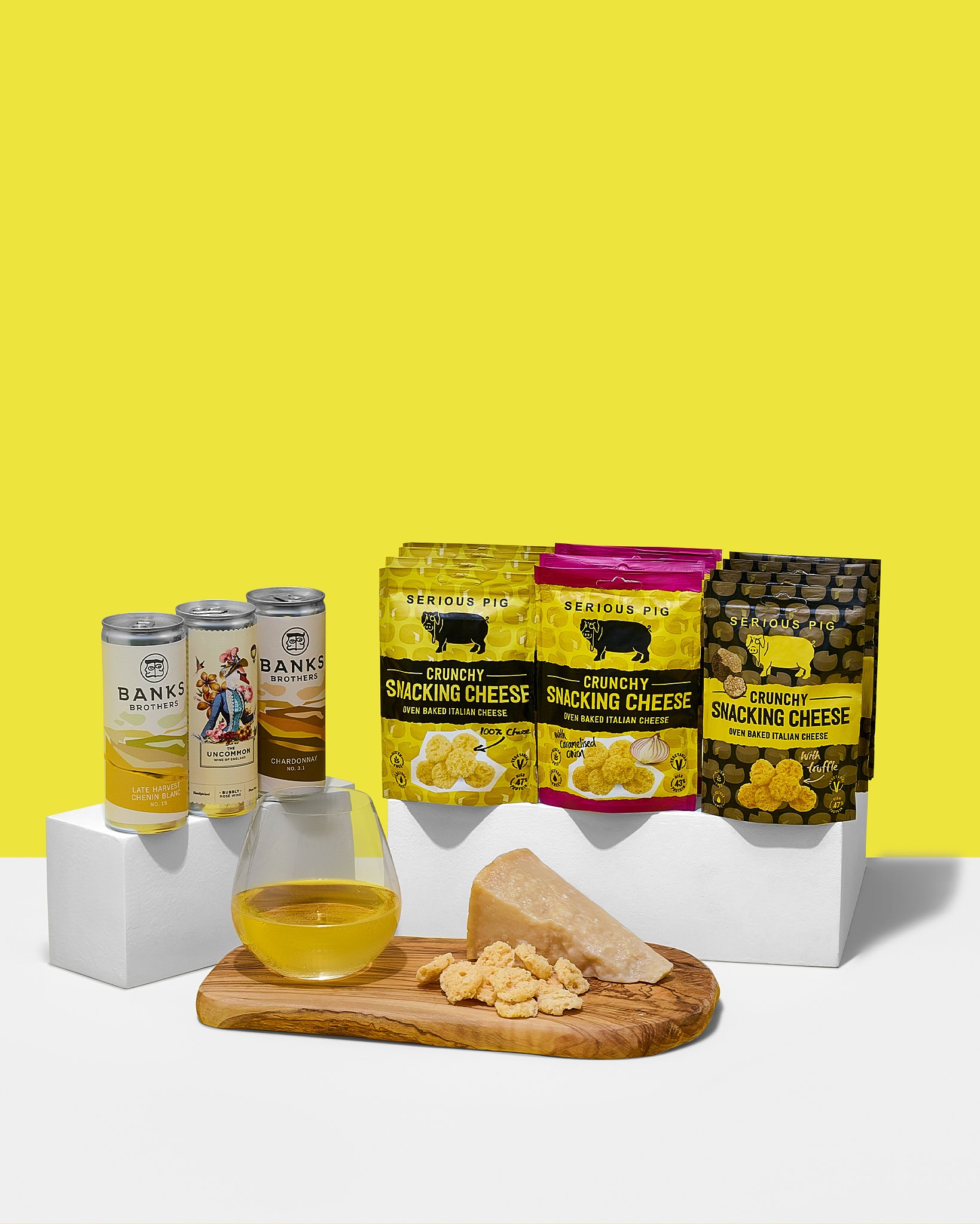 Snacks, cheese and wine, yellow background.jpg