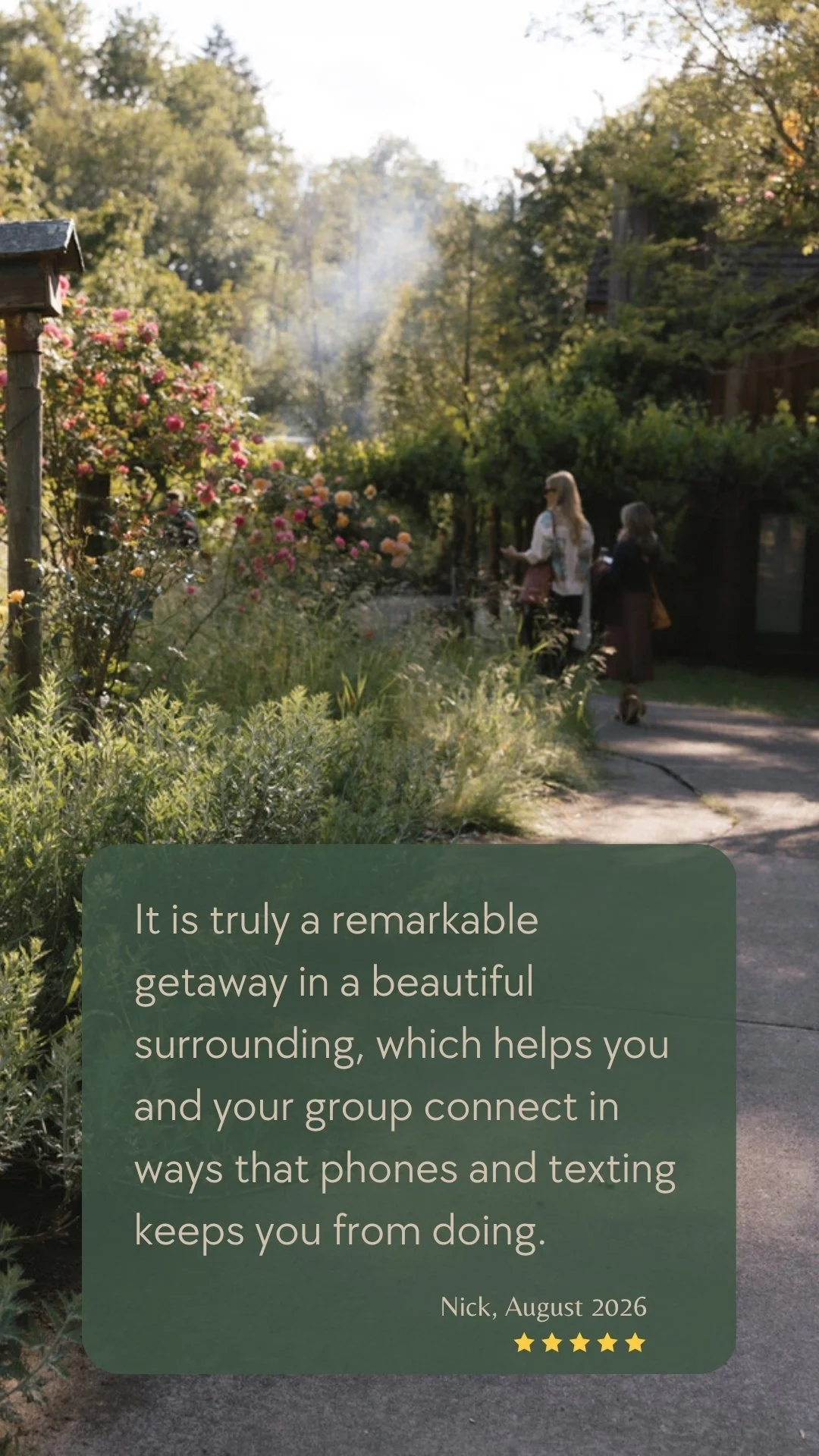 Guests strolling through flowering gardens and wooded grounds at Deep Creek Farmstead, a peaceful group getaway near Portland, Oregon.