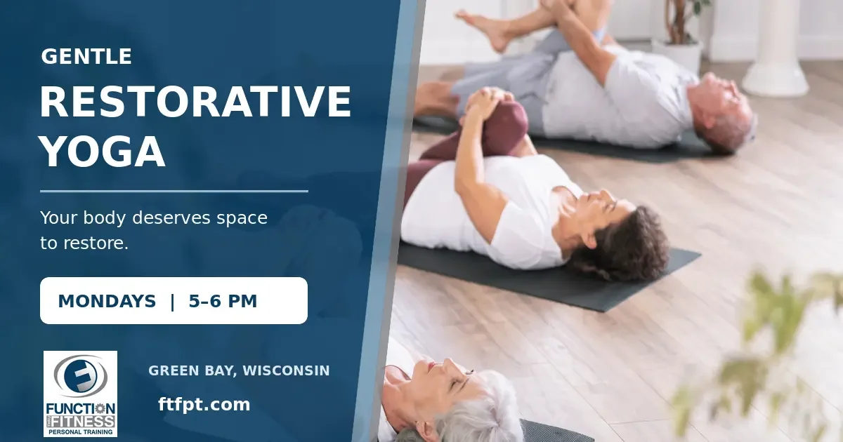 Adults perform gentle restorative yoga stretches during a class.