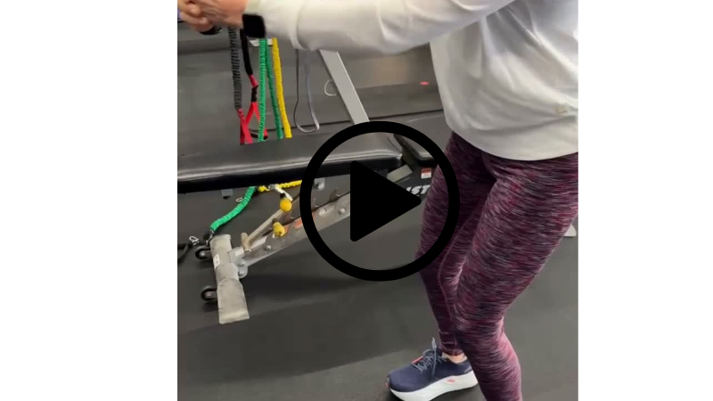 Client performing a Pallof press core stability exercise during personal training at Function Thru Fitness in Green Bay WI