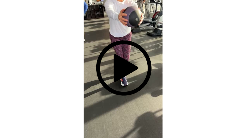 Client performing a single-leg squat during personal training to improve balance and strength at Function Thru Fitness in Green Bay WI