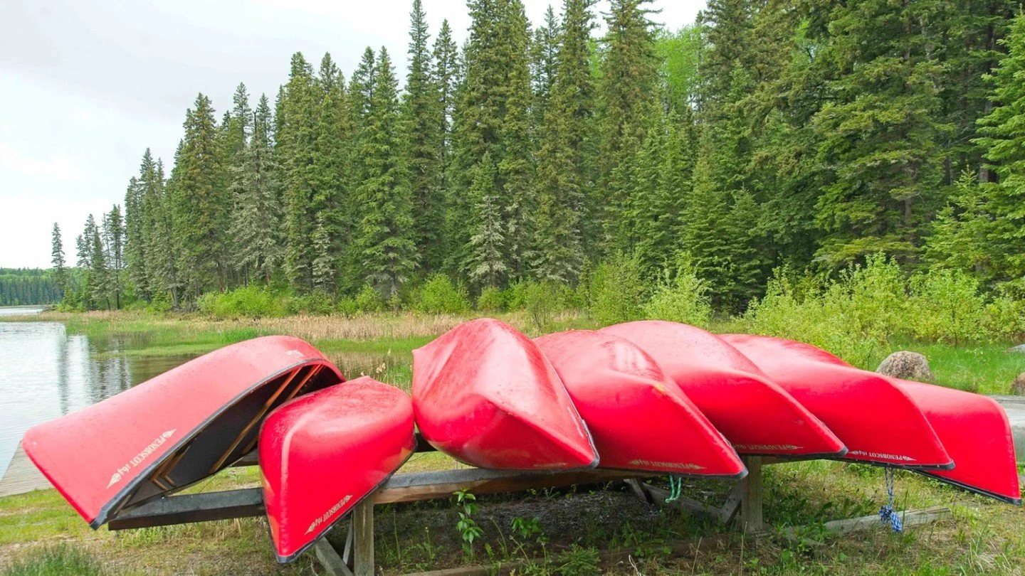 Canoes and Forest PANP - Bill Armstrong - PRPA / Outing Colour Digital Image 2025 Competition - 2nd Place.

Bright red canoes resting upside down on a wooden rack near a lake, surrounded by lush forest.

#prpacanada #photography #nature #prairies