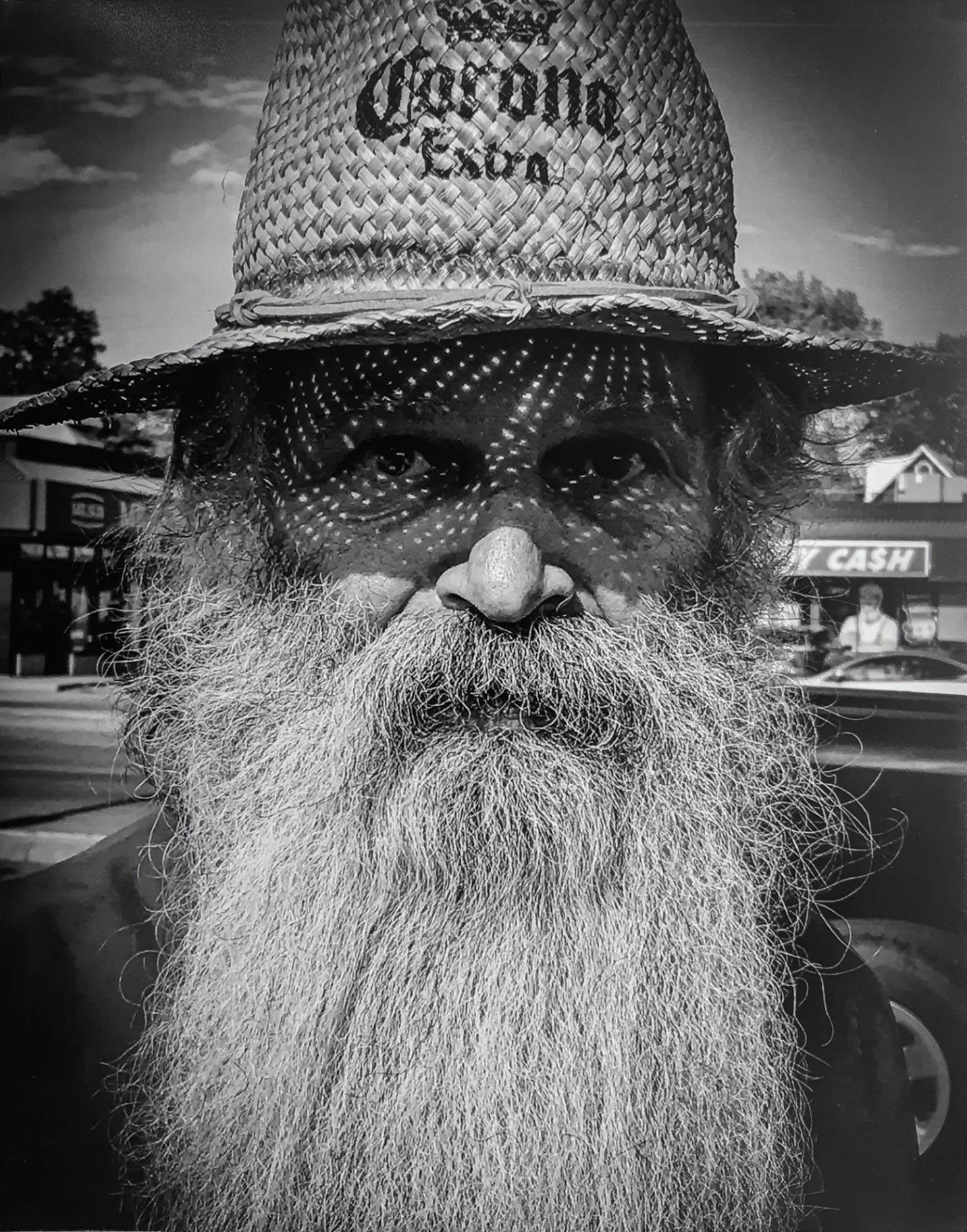 Dots of Light - Wanda Hudson - Human Portraiture 2025 Competition - 1st Place. 

A black-and-white portrait of an older man with a long beard wearing a straw hat that casts a dappled light pattern on his face.

#prpa #prpacanada #photography #portrai