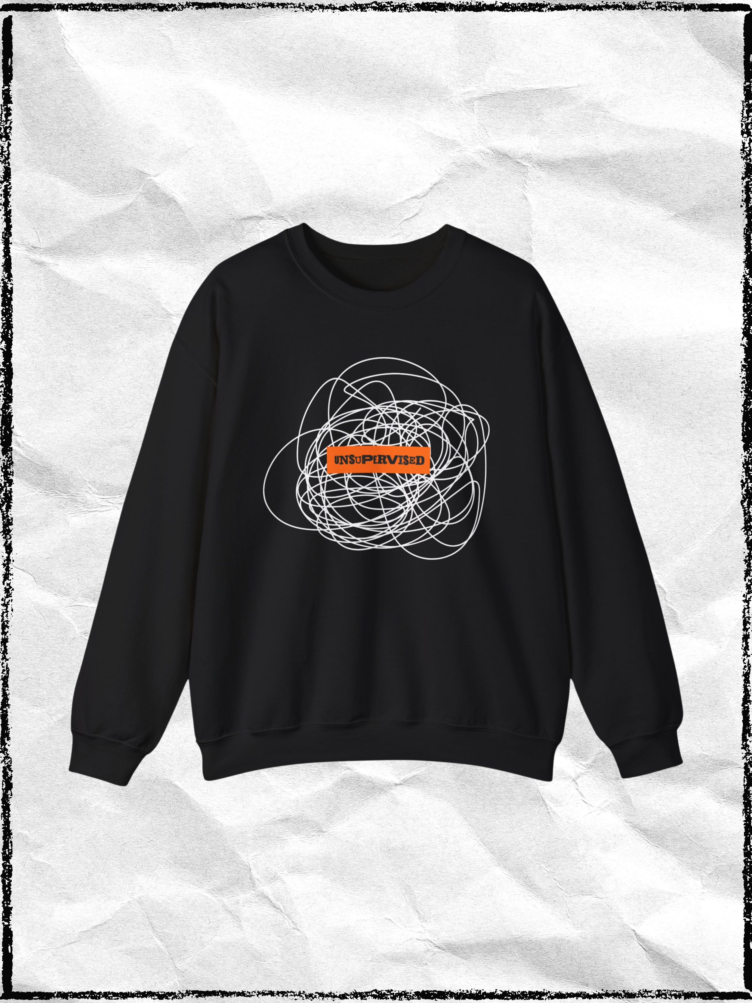 Black sweatshirt with a white abstract scribble graphic and an orange rectangle with the text 'UNSUPERVISED' on the front.
