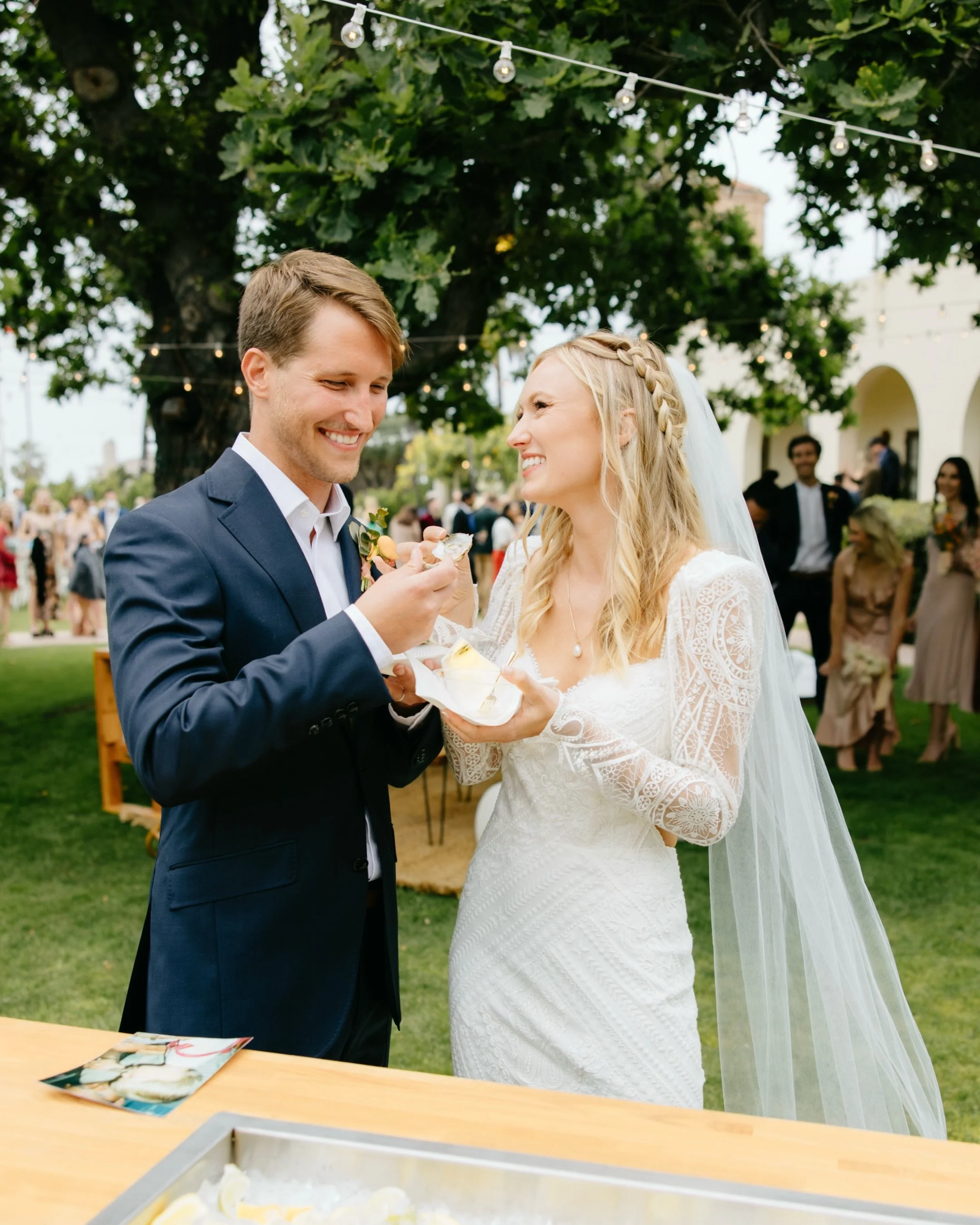 First order of business as husband and wife: crush an oyster 🦪
Oyster Bar: @hemingways_mobile_oyster_bars 
Photo: @kami__lalonde 
Video: @jennaevanspictures 
Venue: @lajollawomansclub 
Florals: @_tinyvictories 
Planner@ @franceslovesfrancis 
Dress: 