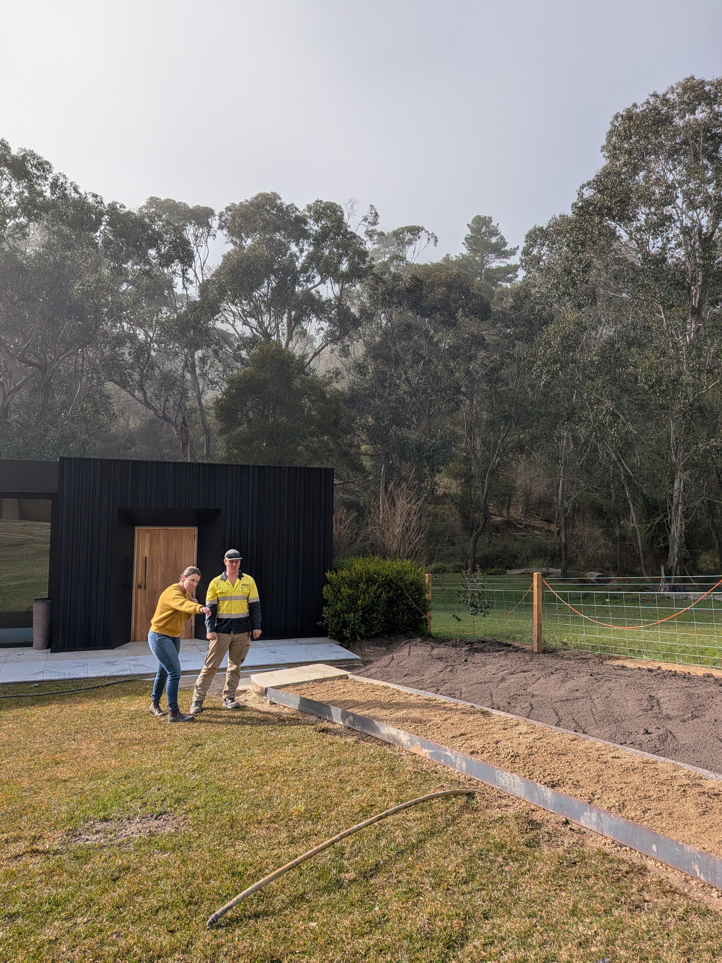 Designer Emily Hanekroot giving onsite feedback to contractor.jpg