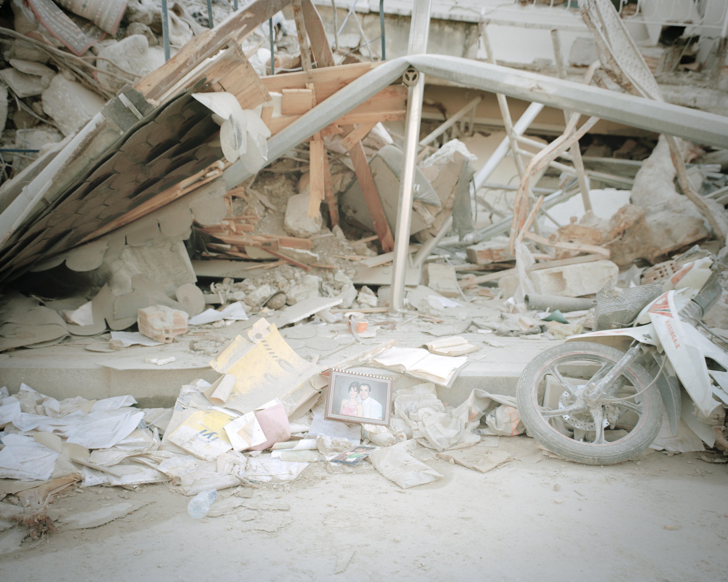 Some photographs in the rubble.
