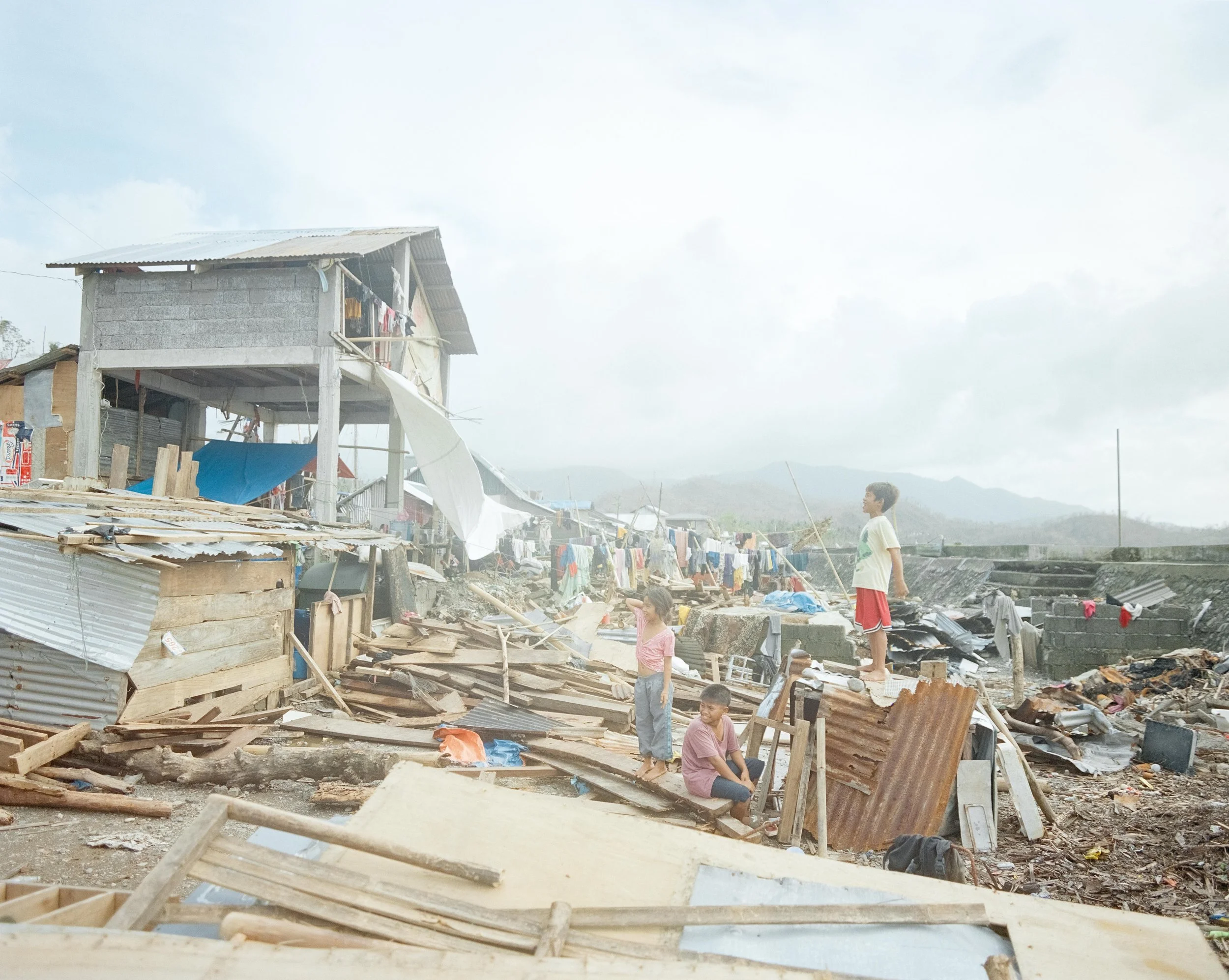 Children play among the rubble in the aftermath of Super Typhoon Fung-wong (also referred to as Uwan).
Super Typhoon Fung-wong struck Catanduanes Island on November 9, 2025, bringing destructive winds, heavy rainfall, landslides, and widespread flood