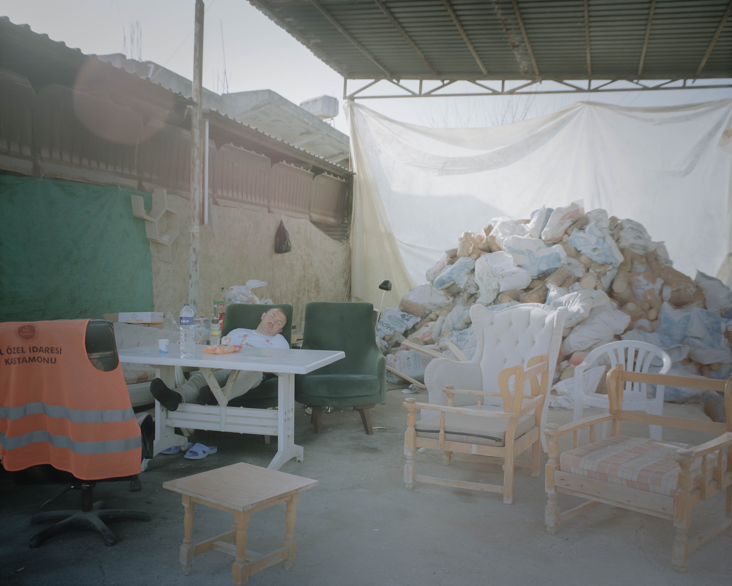 A worker who rests on a chair.