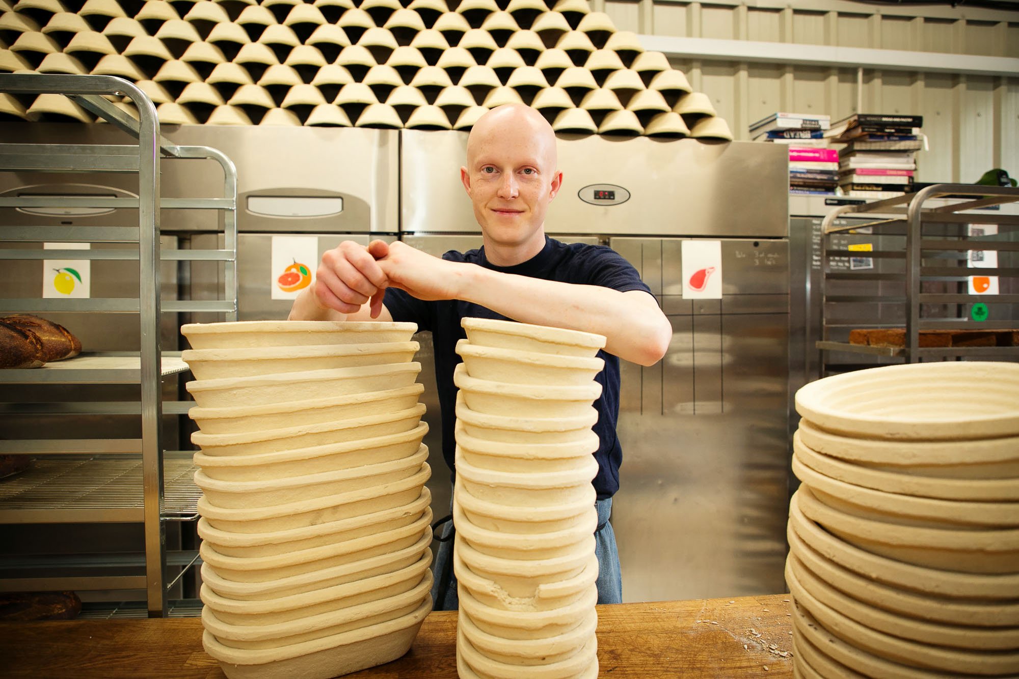 Portrait of baker leaning on bread moulds.jpg