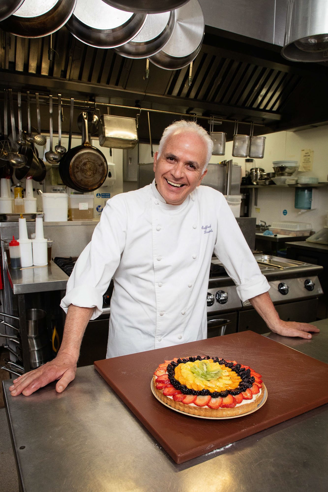 Portrait of a chef with a fruit tart.jpg