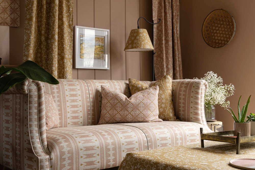 Cushions and a settee upholstered with fabric from the Aventuras Collection by designer Zoe Glencross.jpg