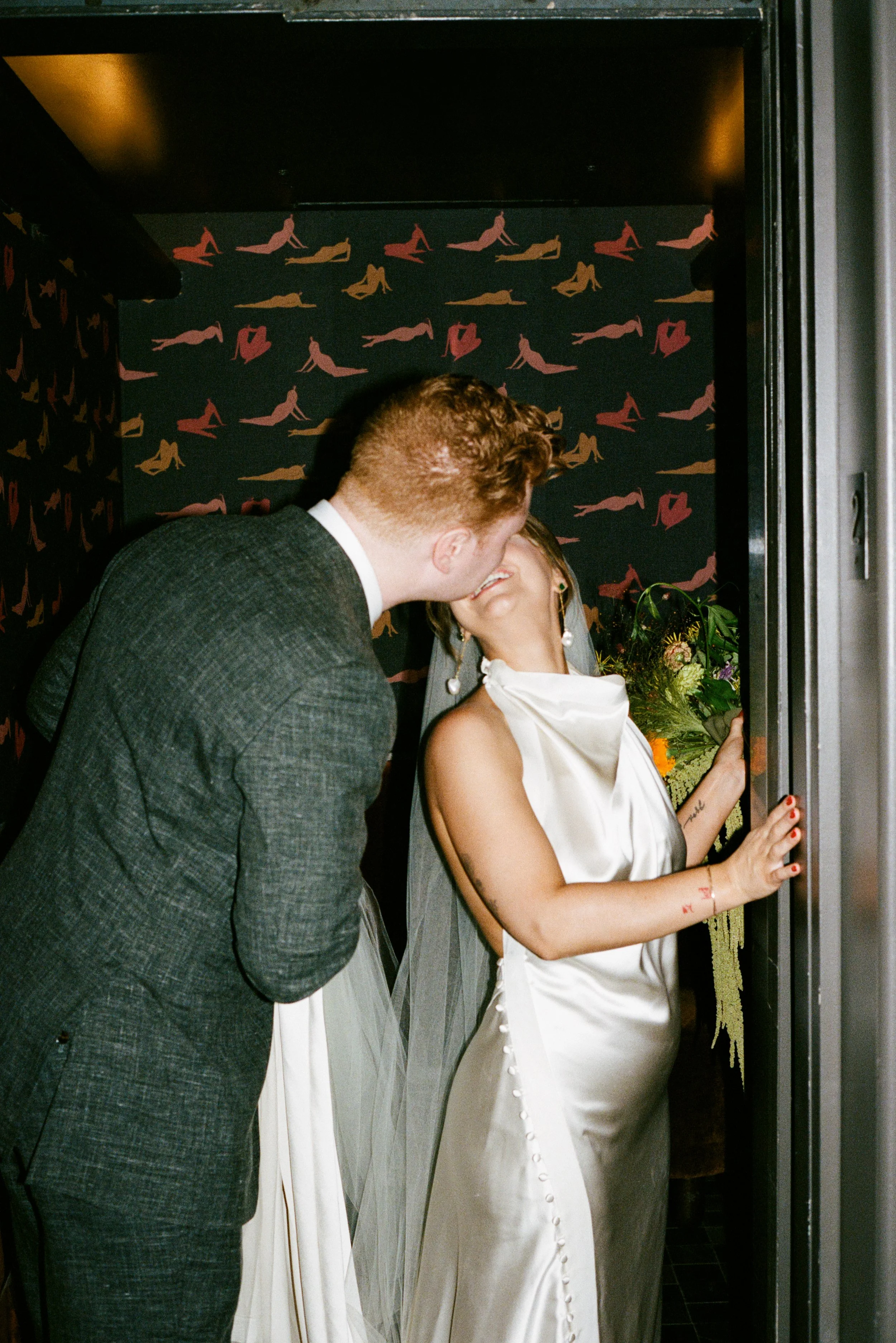 Cool couple kissing on their wedding.