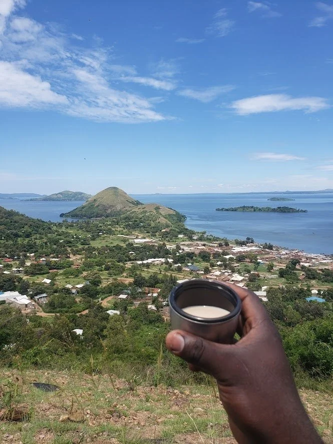  (Picture of me drinking tea, a recent Hike at Port victoria, Busia county, Kenya) 