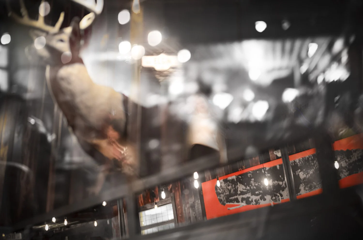 alexander_prior_photographer_vancouver_reflection view showing a restaurant bar setting, whalebone_elgin_st_ottawa.
