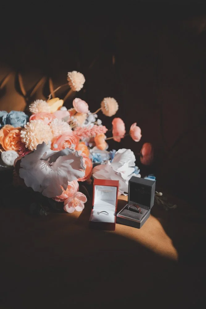 Details of wedding rings and flowers