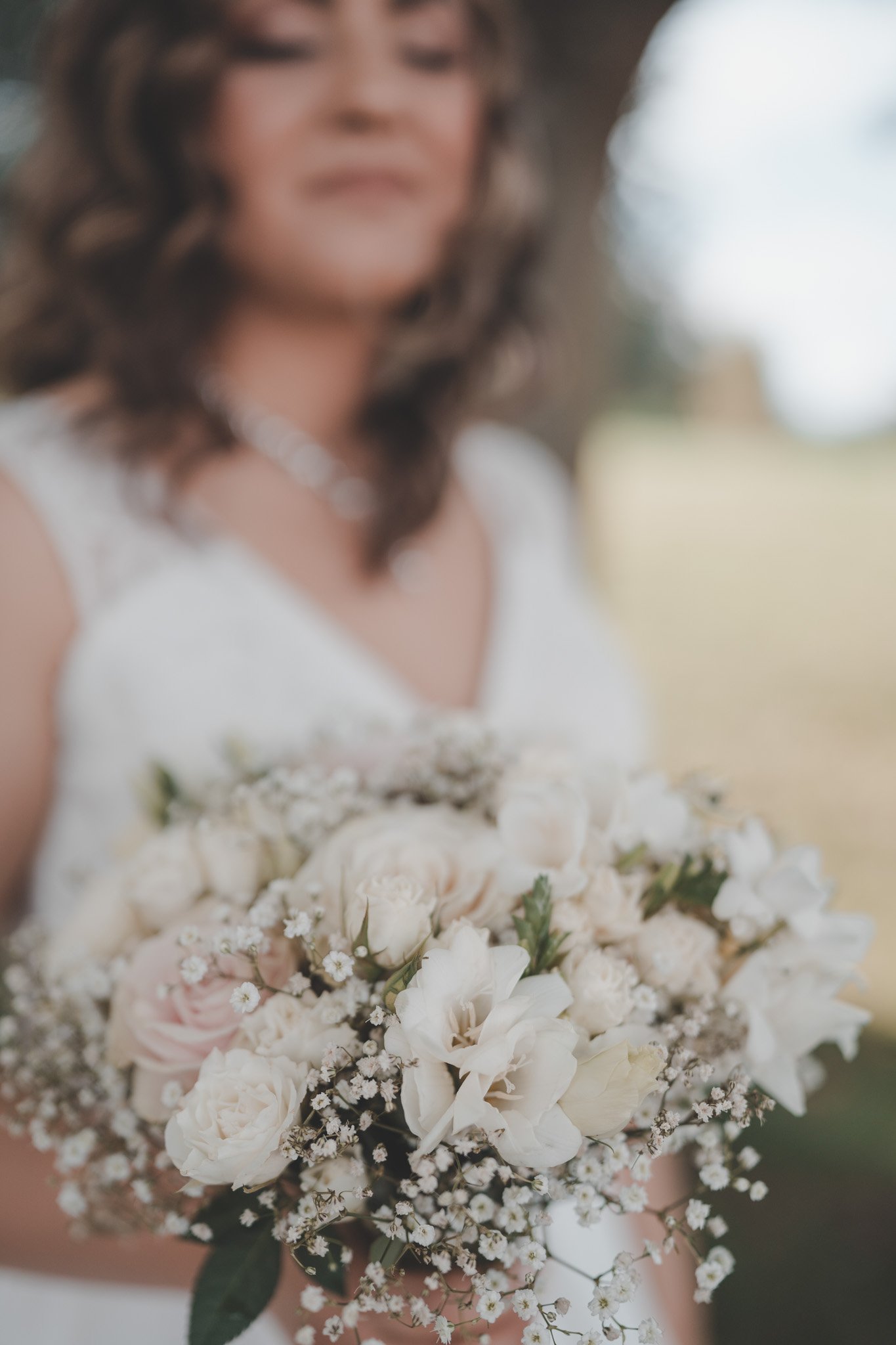 Details of wedding flower bouquet in front of Delta Hotels by Mariott Northampton