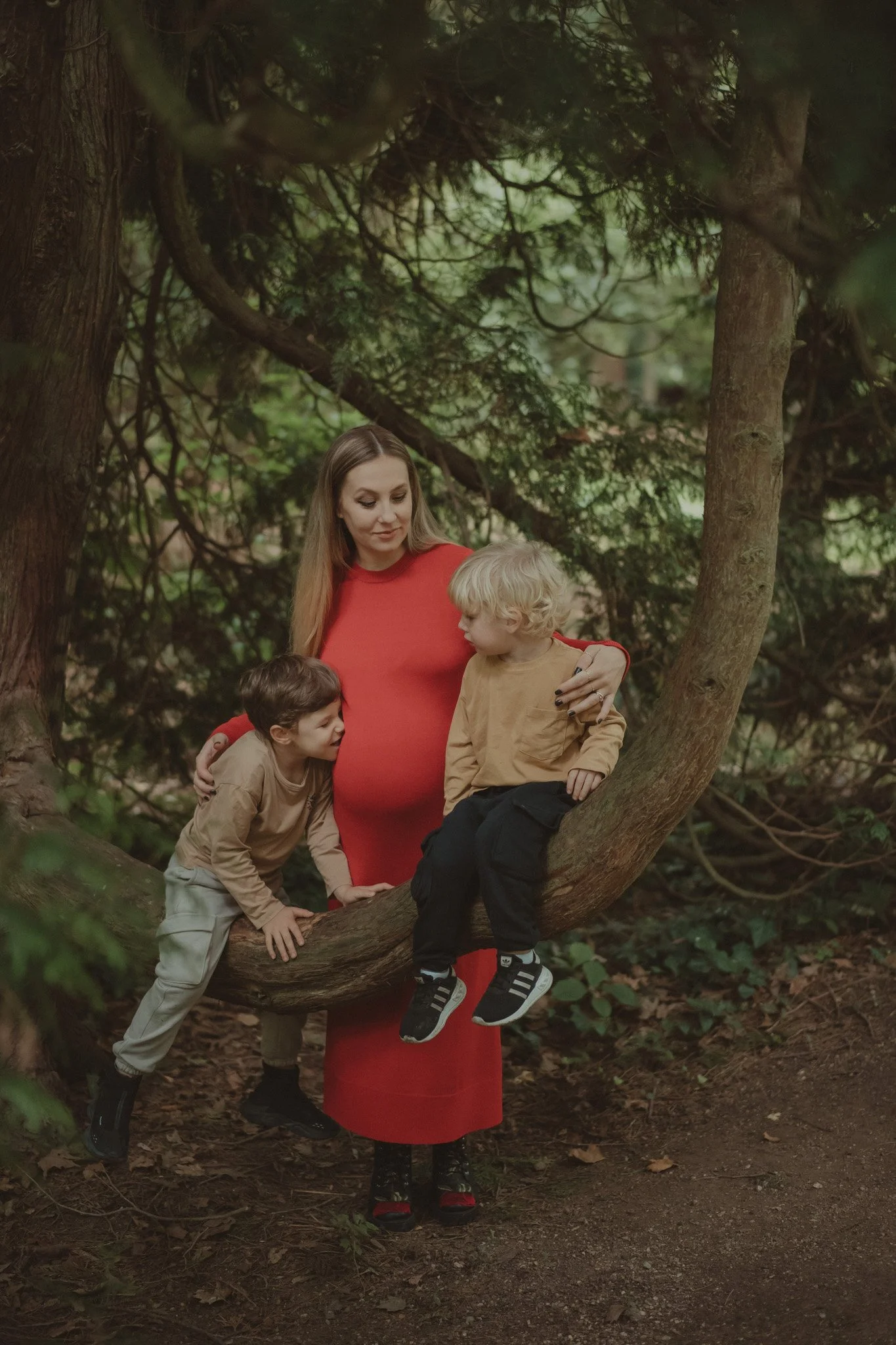 Pregnant mother with her kids at a family photoshoot