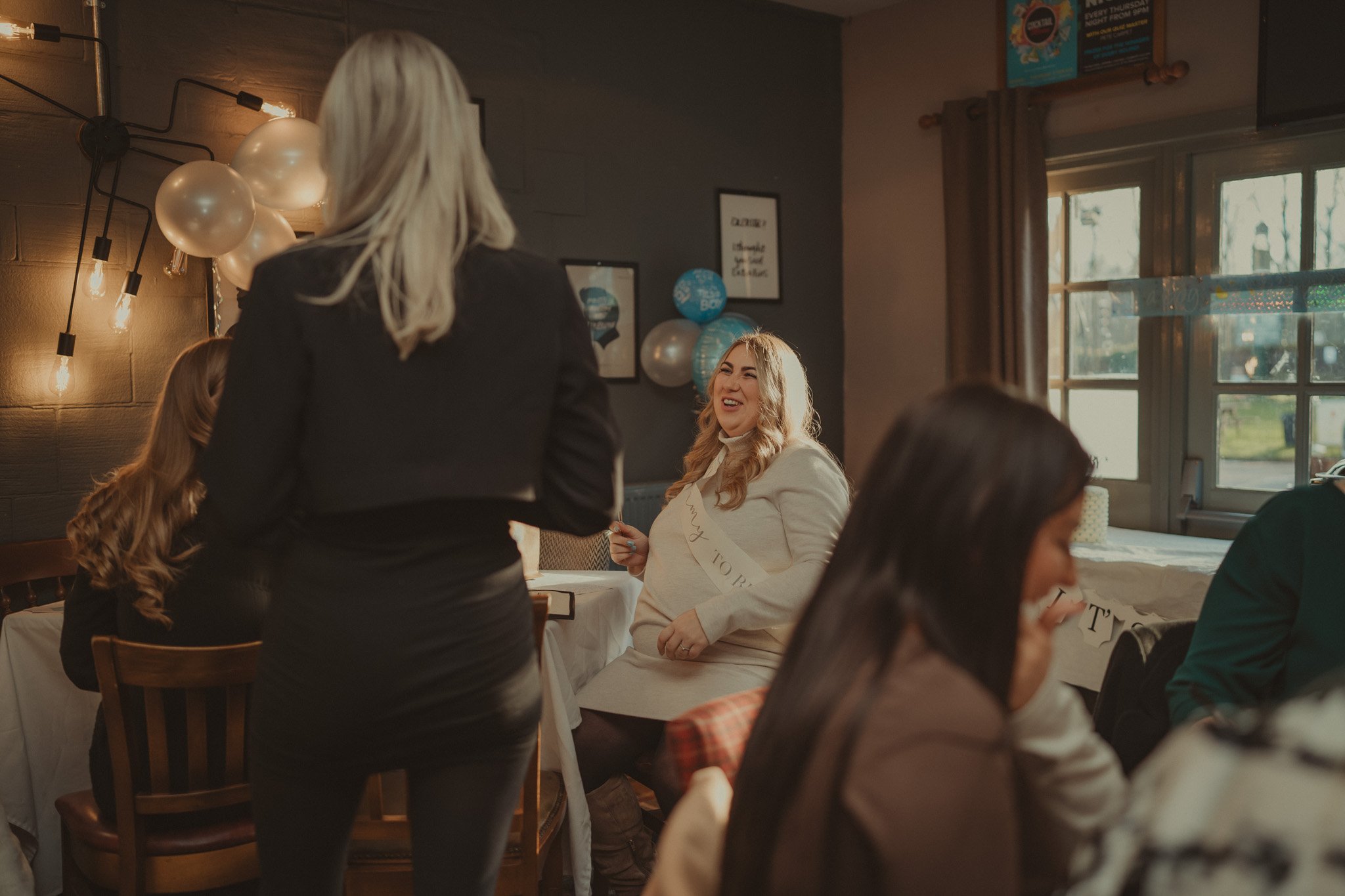 Guests having fun at a baby shower at the Millpool, Coventry