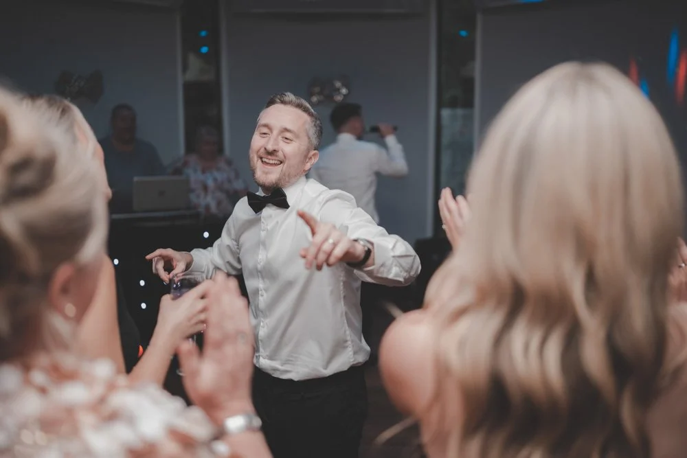 Man having a great time on the dancefloor at Whitehall Hotel Darwen, UK