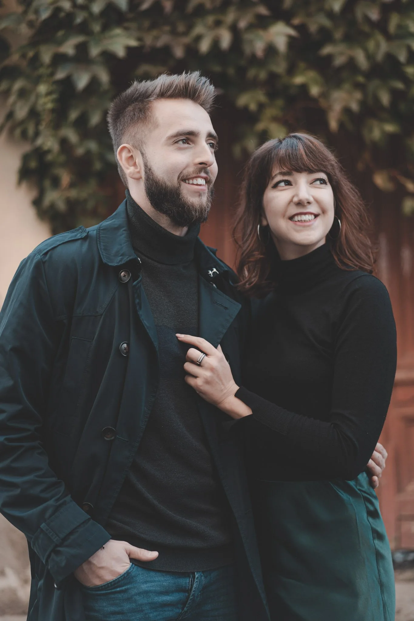 Beautiful couple looking away while photographed