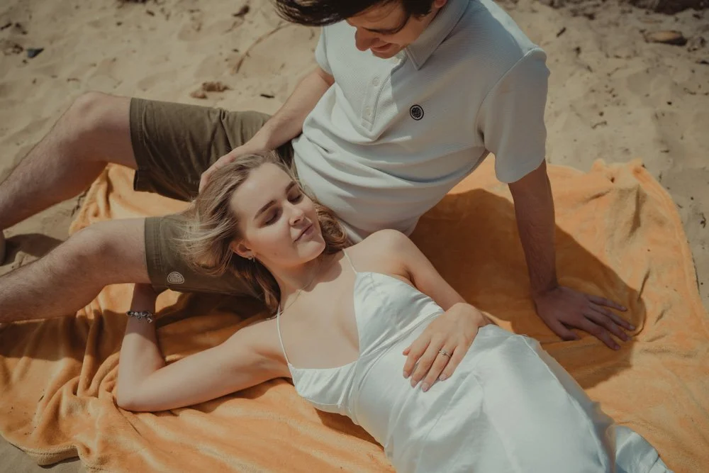 Couple on a blanket on  Covehithe Beach