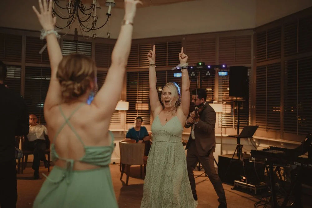 Bridesmaids having fun on the dance floor at Brockencote Hall Hotel, Kidderminster