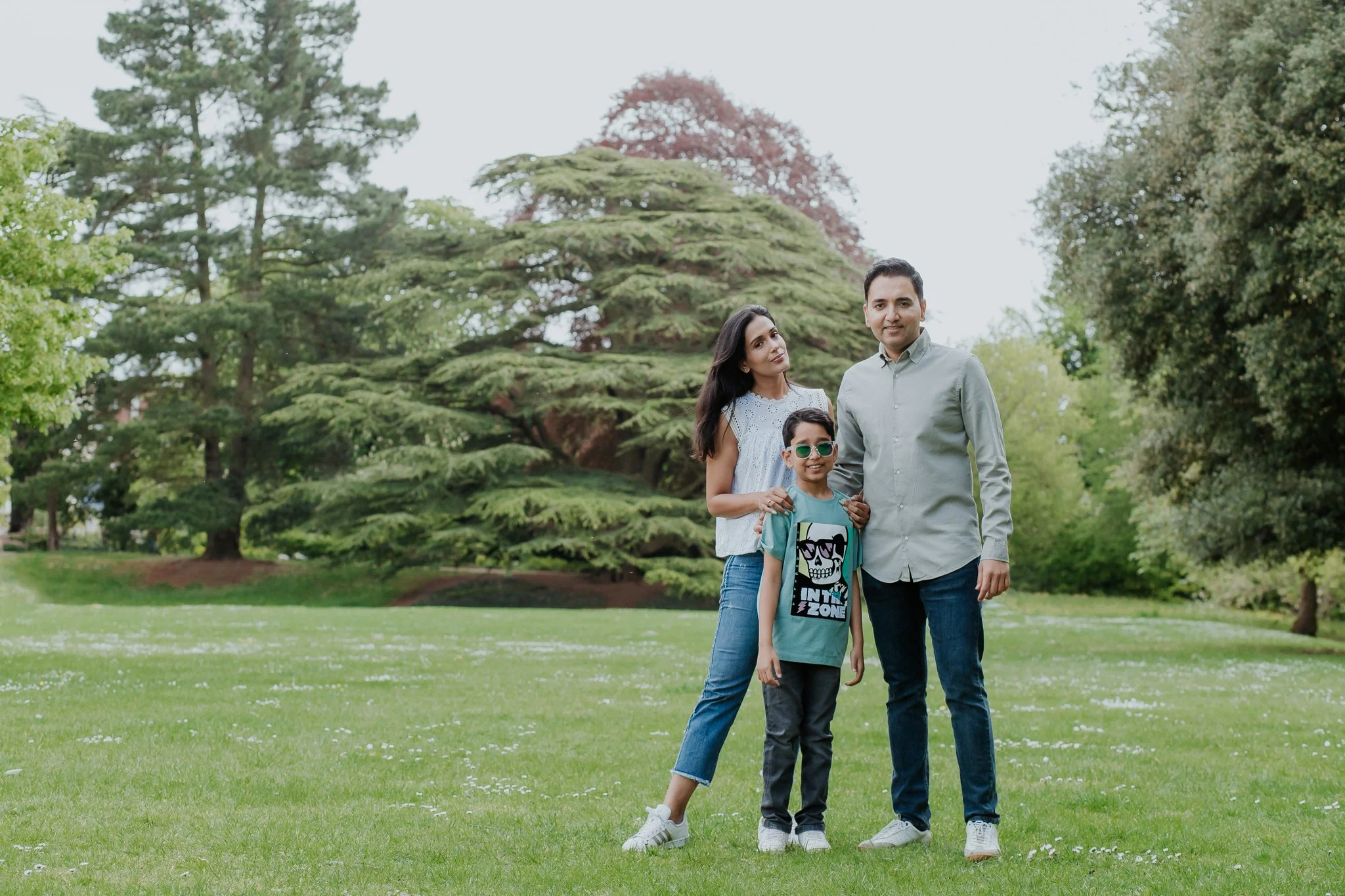 A family of three photographed in a park in Leamington Spa