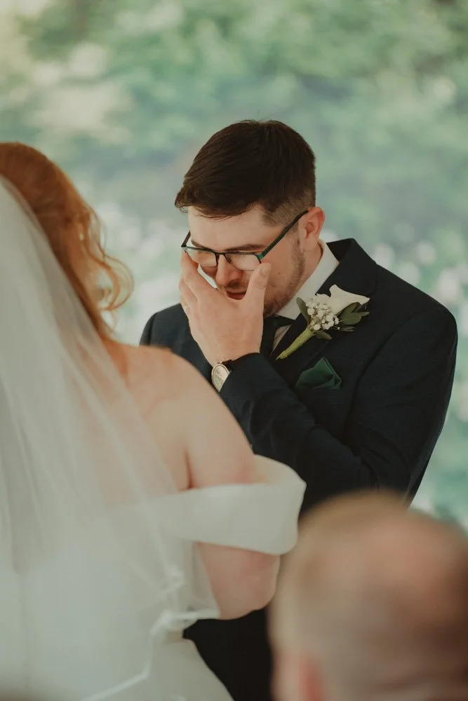 Groom crying during the wedding ceremony, at The White Hart Inn at Lydgate